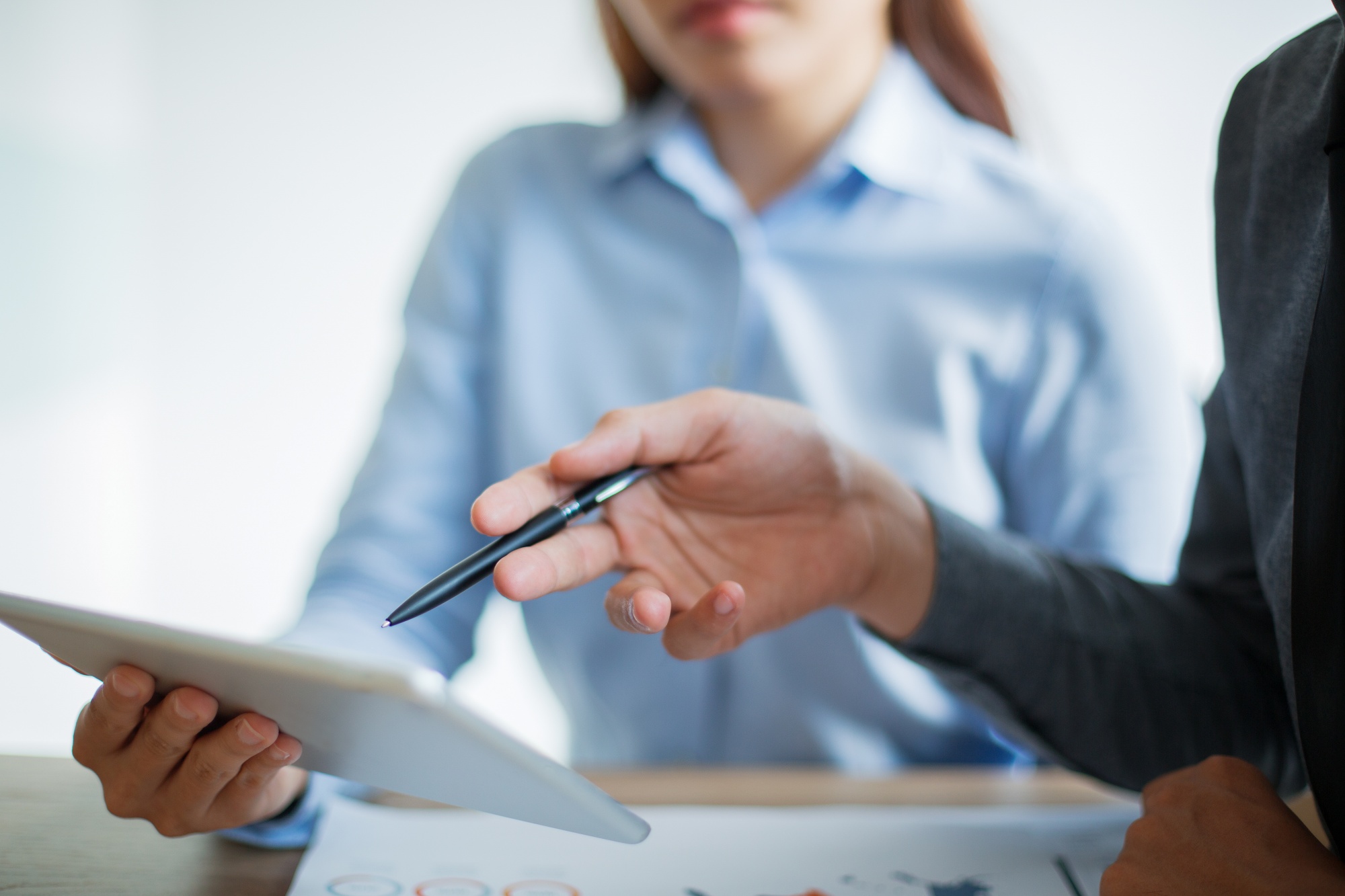 business-team-discussing-information-touchpad